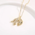Macro detail of gold-plated leopard pendant with shimmering zircons and green gemstone eyes - Full Body Leopard Style (160) / 18K Gold
