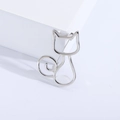 Sleek silver minimalist hollow cat brooch in polished stainless steel for women - Silver