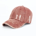 Close-up of distressed washed denim baseball cap featuring vintage ripped details in red - Adjustable / Burgundy