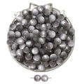 Macro view of grey cat-eye resin beads in a vintage tray for DIY jewelry making - Gray
