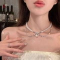 Dubbellaagse parel- en diamantketting met konijnenhanger en zilveren ring - Strik met parel / Zilver