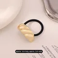 Elastic hair tie featuring a matte gold twisted wave metal charm in a vintage style - Twist Gold