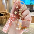Portachiavi tazza tè rosa con liquido glitterato e cinturino in silicone morbido - Cinturino Rosa - Forma del Biberon con Animali dei Cartoni Animati