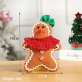 Gingerbread man plush toy with green bow and red scarf for Christmas decor, size 15cm x 17cm - 15cm x 17cm