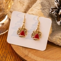Detail of Christmas earrings with gold bow and red bell pendant on holiday backdrop - Red Bell Style (E4357)