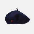 Close-up of navy wool beret featuring detailed red heart embroidery and felt texture - One Size / Navy Blue