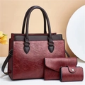 Three-piece red oil wax leather tote bag set including wallet and key pouch on display - Wine Red