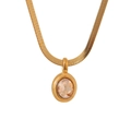 Detailed close-up of golden flat snake chain with an oval champagne zircon pendant - Champagne