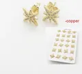 18k gold plated north star stud earrings with micro paved crystals in copper - Sunburst