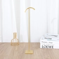 Golden metal jewelry stand with curved hook and square base for luxury necklace display - M