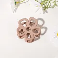 Detail shot of matte flower hair claw clip in soft nude pink with floral decor - Hollow Five-Petal Flower - Matte Khaki