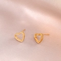 Elegant gold hollow heart earrings with iconic screw motifs on pink satin fabric - Screw Pattern Hollow Heart (E0106) / Gold