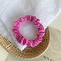Elegant fuchsia satin scrunchie with silky pleated texture for stylish hairstyles - Pink