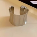 Detail of silver drop open cuff bracelet showing polished surface and vertical dot patterns - Silver Polished Dotted Stripe Style