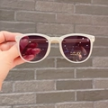 Detail of foldable children sunglasses with UV400 protection and translucent frames - Apricot