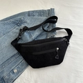 Black corduroy waist bag with dual zipper pockets and adjustable buckle strap on denim - Black