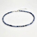 Close-up of 4mm blue and white natural stone beads necklace with silver lobster clasp - Sodalite