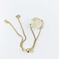 Detail of adjustable gold box chain bracelet with large irregular natural quartz stone - Citrine