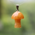 Polished 2cm yellow tiger eye mushroom pendant with a silver metal clasp - Topaz