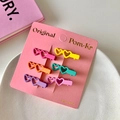 Set of six heart-shaped macaron hair clips in matte finish on a pink display card - Candy Color Double Heart