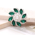Detailed view of luxury gemstone flower brooch with green crystals and pearls - D2710 Horse Eye Gem Flower / Green