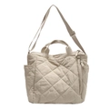Beige quilted tote bag with diamond stitching, featuring soft fabric and adjustable strap - Off White