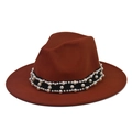 Detailed view of rust-red felt hat with pearl-embellished black ribbon band decoration - Caramel Fedora with Pearl Chain