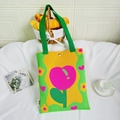 Vibrant knit shoulder tote bag with pink heart and yellow flower on green base - Tulip Green Pink