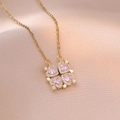 Macro shot of rose gold necklace featuring pink heart stones and crystal pavé details - Pink (X2987)