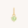 Macro shot of green round cubic zirconia birthstone pendant in 18k gold-plated setting - August Gold