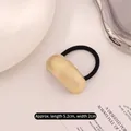 Golden textured grid metal hair tie with high elasticity black band for elegant styling - Curved Small Grid Gold