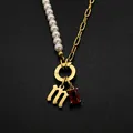 Elegant gold-plated stainless steel necklace with faux pearl chain and letter M pendant - Gothic Letter M