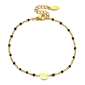 Gold-plated stainless steel bracelet featuring black beads and a circular Yin Yang charm - Gold/Black