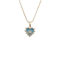 Gouden hartvormige ketting met boze oog ontwerp en blauw emaille op witte achtergrond - 50VM Slangenketting / Blauw