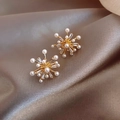 Elegant gold C-shaped starburst earrings with white pearls and sparkling zircons - Gold Fireworks Starburst Stud Earrings
