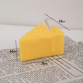 Yellow cheese shaped scented candle with realistic texture and 45 degree angle view - Lava Cheese