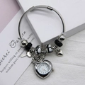 Women's beaded bracelet watch with heart quartz dial, flower, and key charms - Black