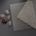Detail of gold bow nail art stickers with metallic finish and 3D decorative patterns - Gold Bowknot Series (CO-121)