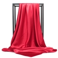 Detail of red satin square scarf showing smooth glossy texture and elegant drape - Red