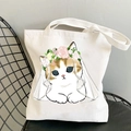 Kawaii cat print white canvas tote bag with floral veil design on a black metal chair - Flower Wreath Veil Cat