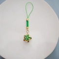 DIY green braided phone strap featuring a white and gold floral cloisonné bell charm - 14mm / Green (with Lanyard)