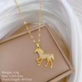Detailed view of horse pendant with clear rhinestones and dimensions on beige jewelry box - Gold Horse Pendant (A527 Titanium Steel Chain Copper Micro-paved Pendant)