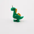Detail view of 32x20mm green dinosaur charm with orange spikes and top metal loop - Dinosaur