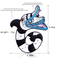Exaggerated rattlesnake enamel pin in black and white stripes with zinc alloy finish - Striped Sandworm