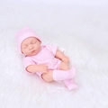 20cm reborn baby doll in pink polka dot outfit resting on a white faux fur blanket - Pink Polka Dot Style