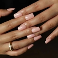 Glossy nude pink square press-on nails shown on hand with a professional finish - Nude Pink