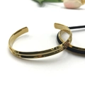 Polished C-shaped gold stainless steel open bangle with central groove design - V-Shape Gold