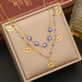 Zweilagige Goldkette mit blauem Evil-Eye-Anhänger und bunten Perlen auf einer Schmuckschatulle - 2# Auge