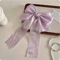 Elegant purple sheer mesh bow hair clip with long ribbons on a decorative wooden tray - Purple
