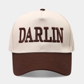 Close-up of DARLIN embroidery on a two-tone beige and brown vintage trucker hat - Adjustable / Dark Brown